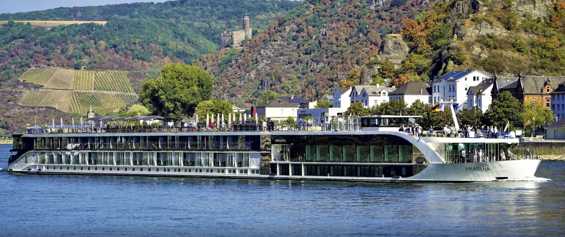AmaSiena sailing past vineyard-covered hills along the Rhine