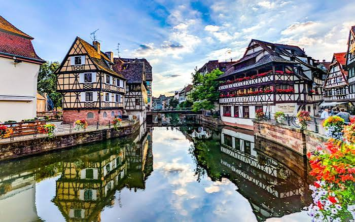 Half timbered houses reflected in the canal at La Petite France, Strasbourg